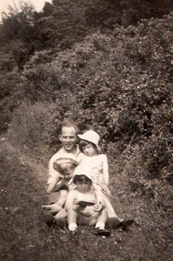 Alex's father with his family